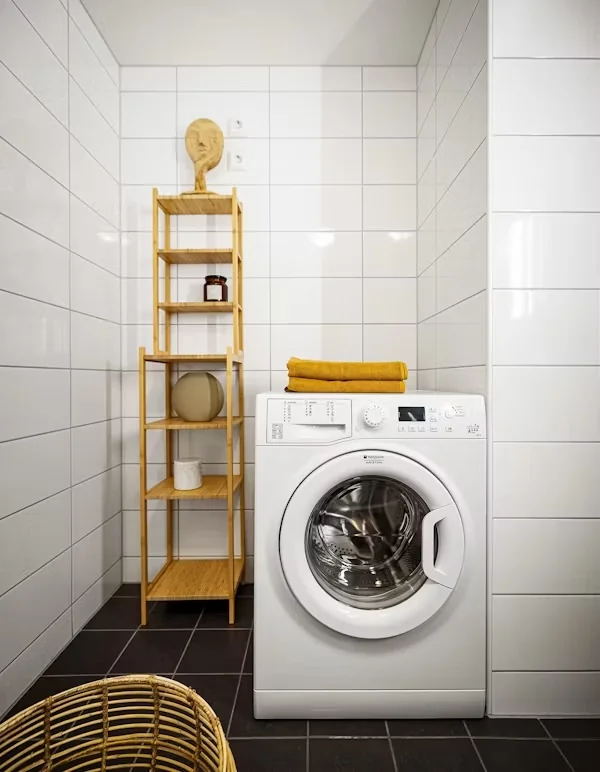 Modern laundry room with a washing machine.
